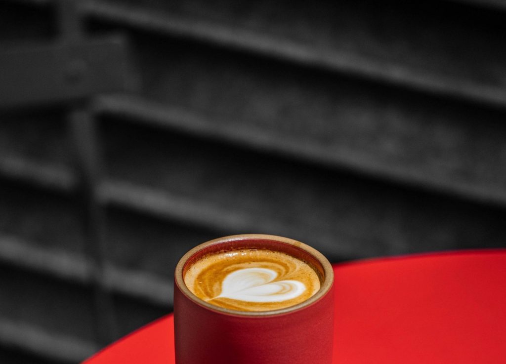 Macchiato coffee in red cup